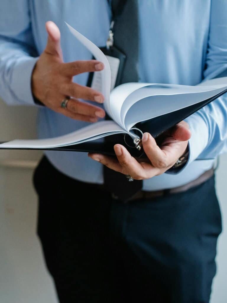A man holding an open book.